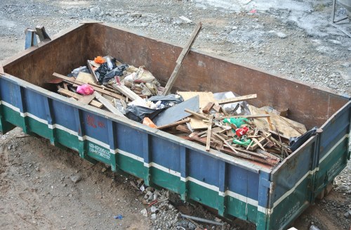 Workers preparing to load commercial waste onto a collection vehicle